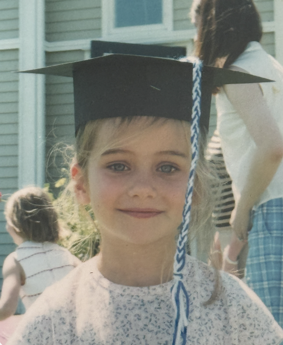Callie in her childhood graduation cap